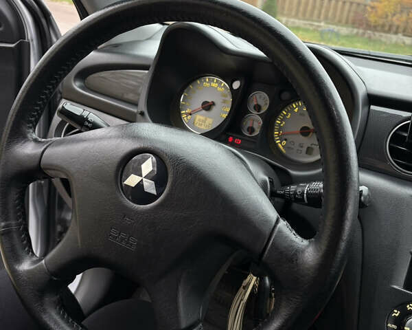 Серый Мицубиси Аутлендер, объемом двигателя 2.38 л и пробегом 238 тыс. км за 7450 $, фото 21 на Automoto.ua