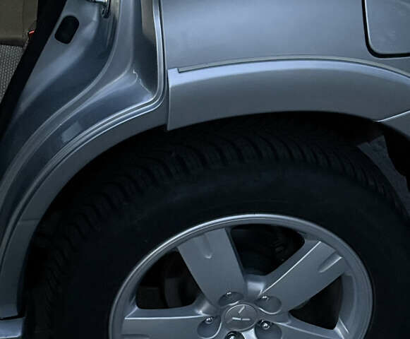 Серый Мицубиси Аутлендер, объемом двигателя 2.38 л и пробегом 238 тыс. км за 7450 $, фото 43 на Automoto.ua