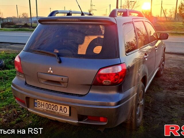 Сірий Міцубісі Аутлендер, об'ємом двигуна 2.4 л та пробігом 211 тис. км за 5000 $, фото 2 на Automoto.ua