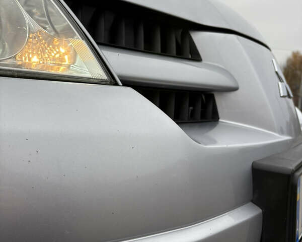 Серый Мицубиси Аутлендер, объемом двигателя 2.38 л и пробегом 238 тыс. км за 7450 $, фото 8 на Automoto.ua