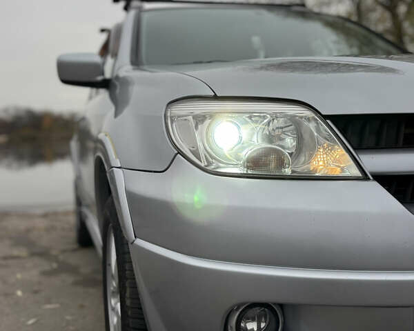 Серый Мицубиси Аутлендер, объемом двигателя 2.38 л и пробегом 238 тыс. км за 7450 $, фото 10 на Automoto.ua