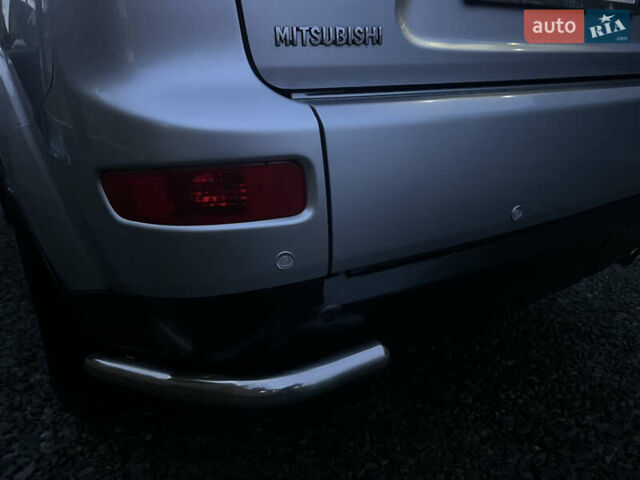 Серый Мицубиси Аутлендер, объемом двигателя 2.4 л и пробегом 236 тыс. км за 7600 $, фото 56 на Automoto.ua
