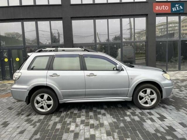 Серый Мицубиси Аутлендер, объемом двигателя 2.38 л и пробегом 280 тыс. км за 5800 $, фото 6 на Automoto.ua