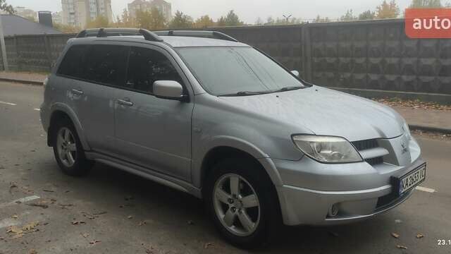 Сірий Міцубісі Аутлендер, об'ємом двигуна 2.38 л та пробігом 200 тис. км за 6550 $, фото 2 на Automoto.ua