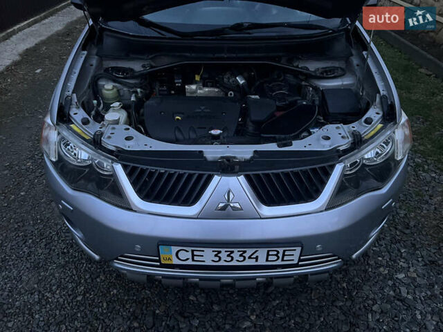 Серый Мицубиси Аутлендер, объемом двигателя 2.4 л и пробегом 236 тыс. км за 7600 $, фото 41 на Automoto.ua