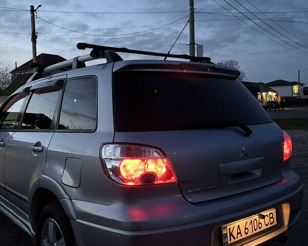 Серый Мицубиси Аутлендер, объемом двигателя 2.38 л и пробегом 238 тыс. км за 7450 $, фото 56 на Automoto.ua