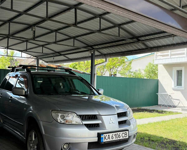 Серый Мицубиси Аутлендер, объемом двигателя 2.38 л и пробегом 238 тыс. км за 7450 $, фото 48 на Automoto.ua