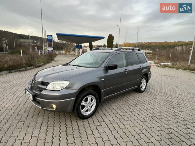 Сірий Міцубісі Аутлендер, об'ємом двигуна 2 л та пробігом 192 тис. км за 6400 $, фото 1 на Automoto.ua