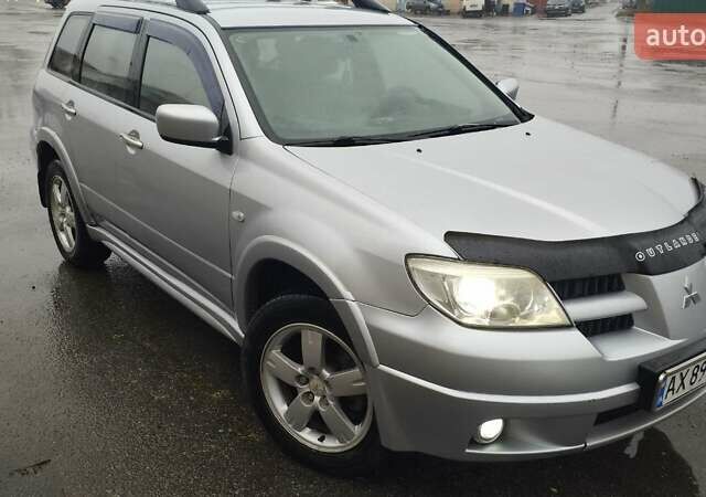 Серый Мицубиси Аутлендер, объемом двигателя 2.38 л и пробегом 204 тыс. км за 6100 $, фото 6 на Automoto.ua
