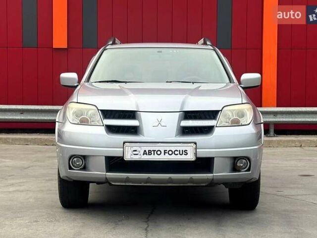 Серый Мицубиси Аутлендер, объемом двигателя 2.38 л и пробегом 245 тыс. км за 5390 $, фото 2 на Automoto.ua
