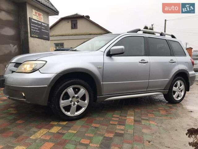 Сірий Міцубісі Аутлендер, об'ємом двигуна 2.4 л та пробігом 167 тис. км за 6400 $, фото 1 на Automoto.ua