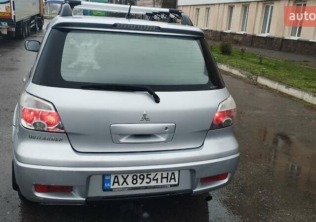 Серый Мицубиси Аутлендер, объемом двигателя 2.38 л и пробегом 204 тыс. км за 6100 $, фото 3 на Automoto.ua