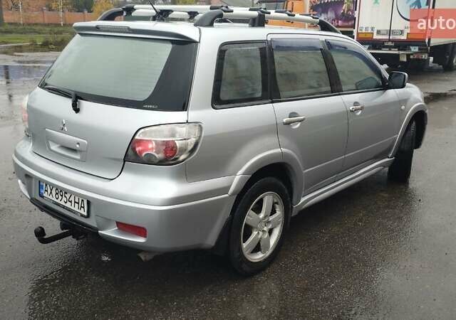 Серый Мицубиси Аутлендер, объемом двигателя 2.38 л и пробегом 204 тыс. км за 6100 $, фото 4 на Automoto.ua