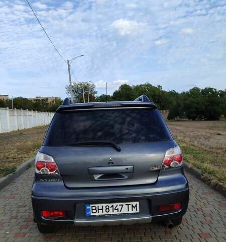 Серый Мицубиси Аутлендер, объемом двигателя 2.38 л и пробегом 189 тыс. км за 7600 $, фото 2 на Automoto.ua