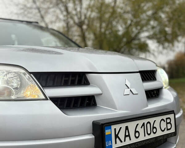 Серый Мицубиси Аутлендер, объемом двигателя 2.38 л и пробегом 238 тыс. км за 7450 $, фото 11 на Automoto.ua