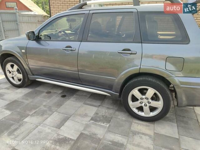 Серый Мицубиси Аутлендер, объемом двигателя 2.4 л и пробегом 23 тыс. км за 8300 $, фото 6 на Automoto.ua