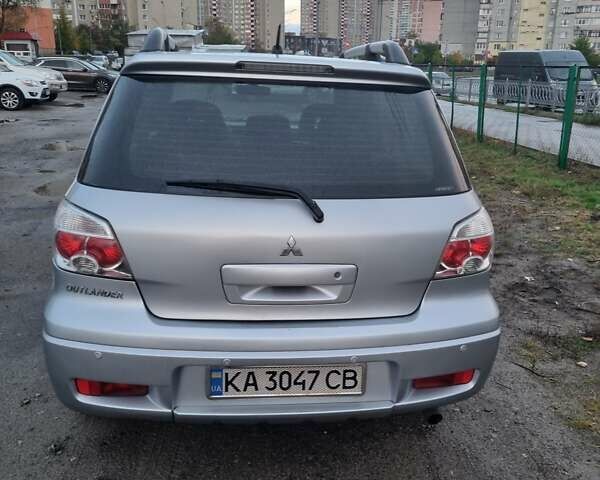 Серый Мицубиси Аутлендер, объемом двигателя 2.38 л и пробегом 245 тыс. км за 7580 $, фото 12 на Automoto.ua