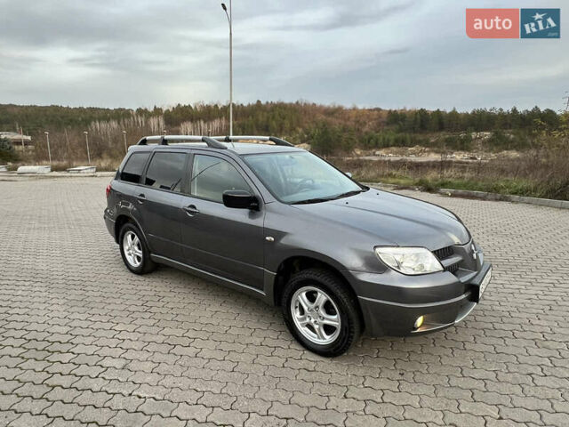 Серый Мицубиси Аутлендер, объемом двигателя 2 л и пробегом 196 тыс. км за 6450 $, фото 19 на Automoto.ua