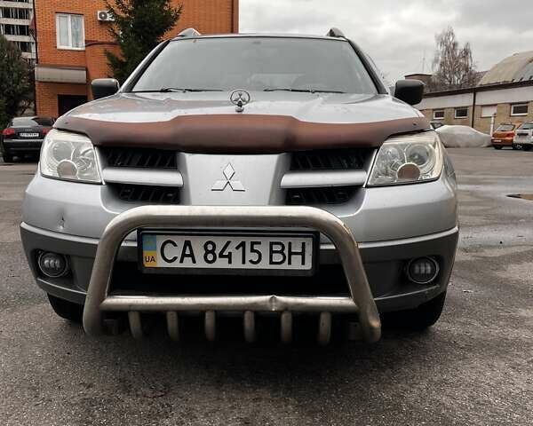 Сірий Міцубісі Аутлендер, об'ємом двигуна 2 л та пробігом 332 тис. км за 6200 $, фото 20 на Automoto.ua
