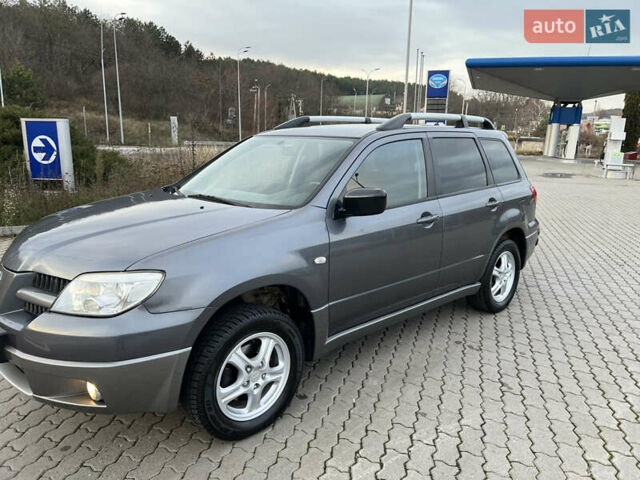 Сірий Міцубісі Аутлендер, об'ємом двигуна 2 л та пробігом 192 тис. км за 6400 $, фото 26 на Automoto.ua