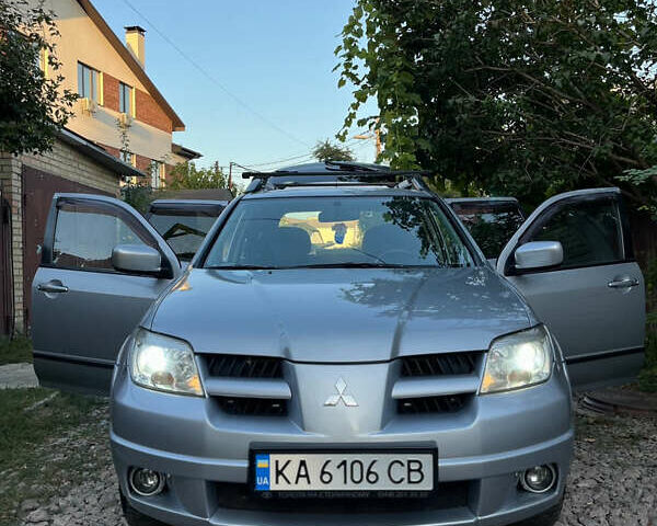 Серый Мицубиси Аутлендер, объемом двигателя 2.38 л и пробегом 238 тыс. км за 7450 $, фото 54 на Automoto.ua