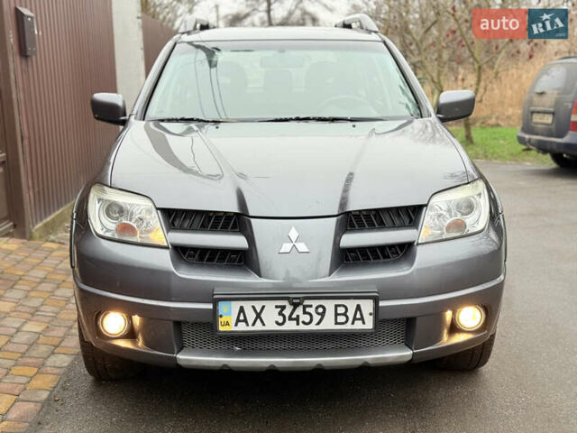 Серый Мицубиси Аутлендер, объемом двигателя 2.4 л и пробегом 240 тыс. км за 6900 $, фото 7 на Automoto.ua