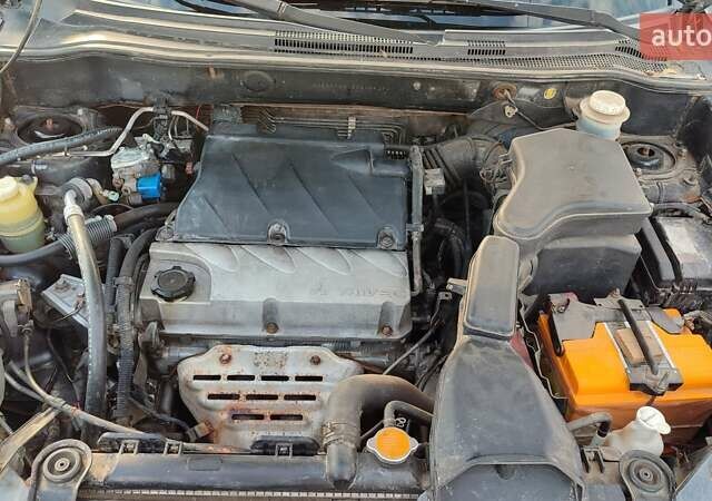 Серый Мицубиси Аутлендер, объемом двигателя 2.38 л и пробегом 189 тыс. км за 7600 $, фото 11 на Automoto.ua