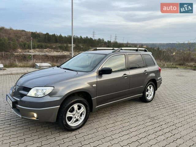 Серый Мицубиси Аутлендер, объемом двигателя 2 л и пробегом 196 тыс. км за 6450 $, фото 26 на Automoto.ua