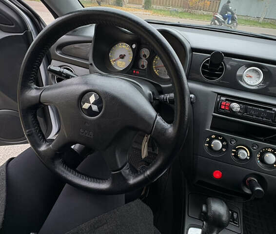 Серый Мицубиси Аутлендер, объемом двигателя 2.38 л и пробегом 238 тыс. км за 7450 $, фото 20 на Automoto.ua