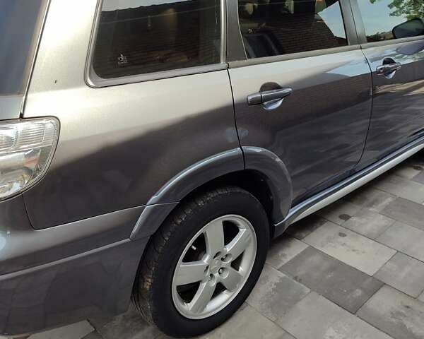 Серый Мицубиси Аутлендер, объемом двигателя 2.4 л и пробегом 23 тыс. км за 8300 $, фото 19 на Automoto.ua