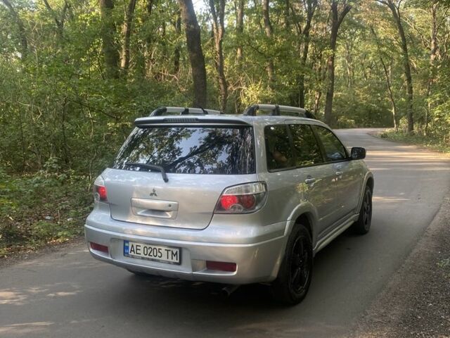 Сірий Міцубісі Аутлендер, об'ємом двигуна 2.4 л та пробігом 307 тис. км за 6700 $, фото 4 на Automoto.ua