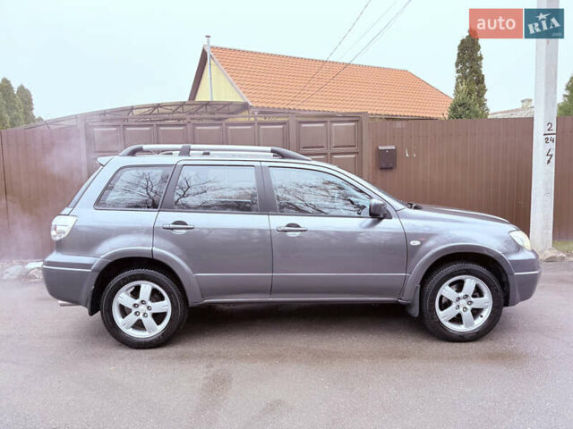 Серый Мицубиси Аутлендер, объемом двигателя 2.4 л и пробегом 240 тыс. км за 6900 $, фото 58 на Automoto.ua