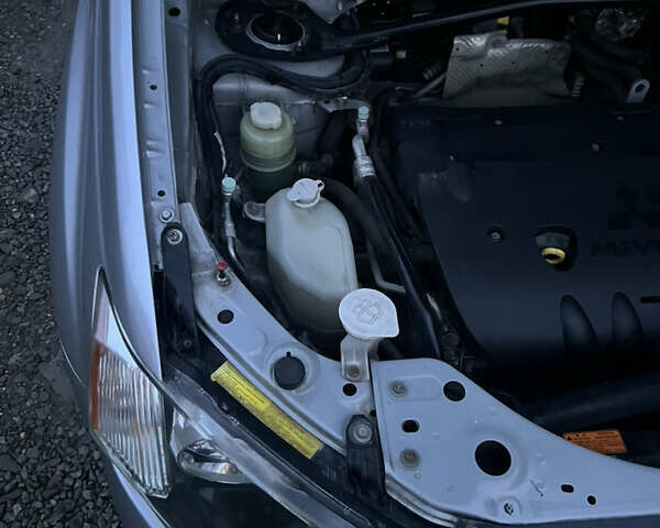 Серый Мицубиси Аутлендер, объемом двигателя 2.4 л и пробегом 236 тыс. км за 7600 $, фото 44 на Automoto.ua