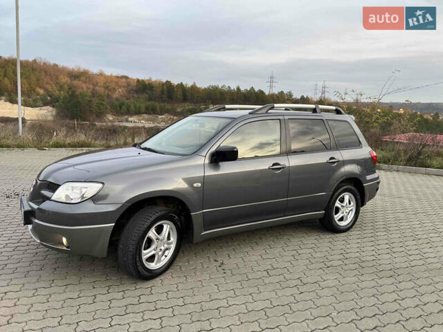 Серый Мицубиси Аутлендер, объемом двигателя 2 л и пробегом 196 тыс. км за 6450 $, фото 40 на Automoto.ua