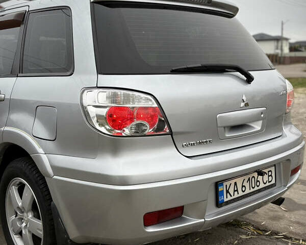 Серый Мицубиси Аутлендер, объемом двигателя 2.38 л и пробегом 238 тыс. км за 7450 $, фото 18 на Automoto.ua