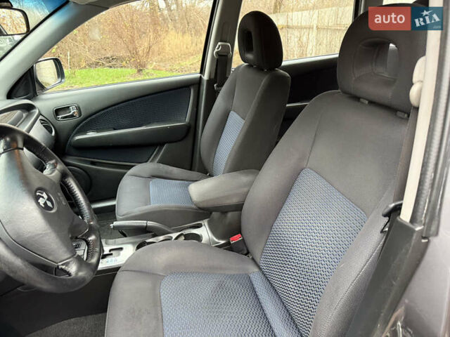 Серый Мицубиси Аутлендер, объемом двигателя 2.4 л и пробегом 240 тыс. км за 6900 $, фото 18 на Automoto.ua