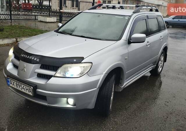 Серый Мицубиси Аутлендер, объемом двигателя 2.38 л и пробегом 204 тыс. км за 6100 $, фото 7 на Automoto.ua