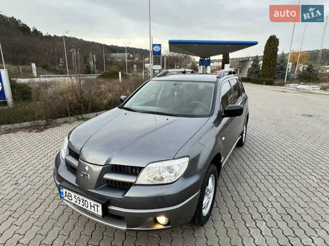 Серый Мицубиси Аутлендер, объемом двигателя 2 л и пробегом 196 тыс. км за 6450 $, фото 1 на Automoto.ua