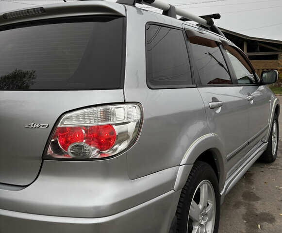 Серый Мицубиси Аутлендер, объемом двигателя 2.38 л и пробегом 238 тыс. км за 7450 $, фото 17 на Automoto.ua