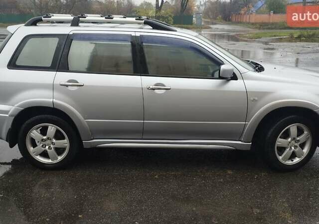 Серый Мицубиси Аутлендер, объемом двигателя 2.38 л и пробегом 204 тыс. км за 6100 $, фото 5 на Automoto.ua