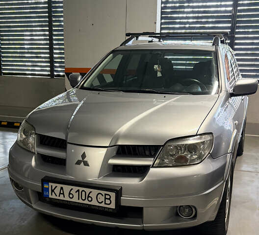 Серый Мицубиси Аутлендер, объемом двигателя 2.38 л и пробегом 238 тыс. км за 7450 $, фото 49 на Automoto.ua