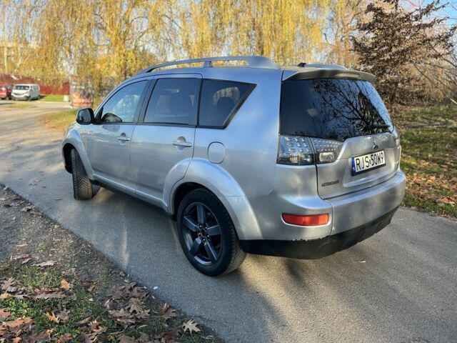 Серый Мицубиси Аутлендер, объемом двигателя 2 л и пробегом 255 тыс. км за 3935 $, фото 3 на Automoto.ua