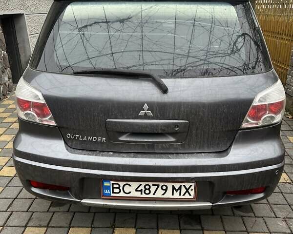 Серый Мицубиси Аутлендер, объемом двигателя 2 л и пробегом 380 тыс. км за 3700 $, фото 1 на Automoto.ua