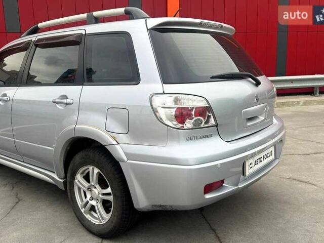 Сірий Міцубісі Аутлендер, об'ємом двигуна 2.38 л та пробігом 245 тис. км за 5990 $, фото 5 на Automoto.ua