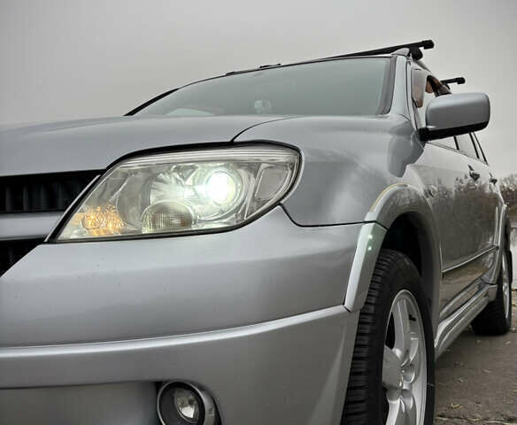 Серый Мицубиси Аутлендер, объемом двигателя 2.38 л и пробегом 238 тыс. км за 7450 $, фото 9 на Automoto.ua