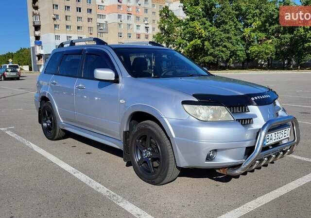 Сірий Міцубісі Аутлендер, об'ємом двигуна 2.4 л та пробігом 260 тис. км за 7300 $, фото 8 на Automoto.ua