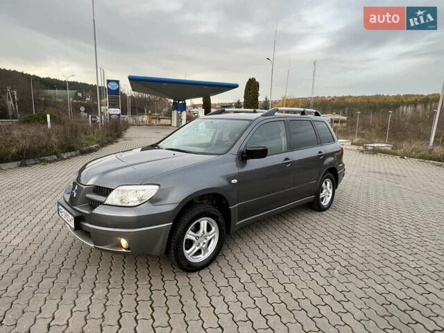 Серый Мицубиси Аутлендер, объемом двигателя 2 л и пробегом 196 тыс. км за 6450 $, фото 37 на Automoto.ua