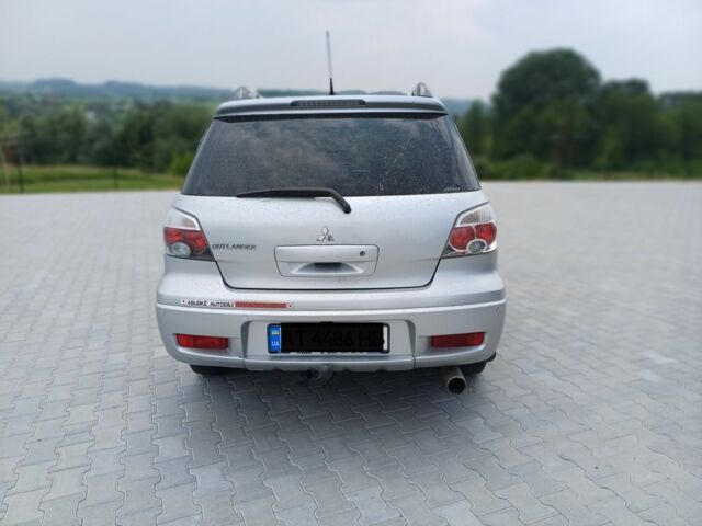 Серый Мицубиси Аутлендер, объемом двигателя 2.4 л и пробегом 243 тыс. км за 6200 $, фото 6 на Automoto.ua