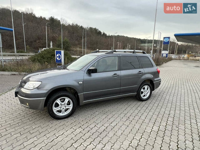Серый Мицубиси Аутлендер, объемом двигателя 2 л и пробегом 196 тыс. км за 6450 $, фото 45 на Automoto.ua