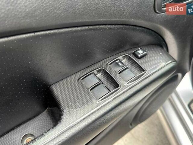 Сірий Міцубісі Аутлендер, об'ємом двигуна 2.38 л та пробігом 245 тис. км за 5990 $, фото 17 на Automoto.ua